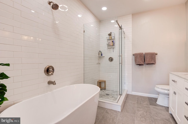 full bathroom with vanity, tile patterned floors, plus walk in shower, and toilet