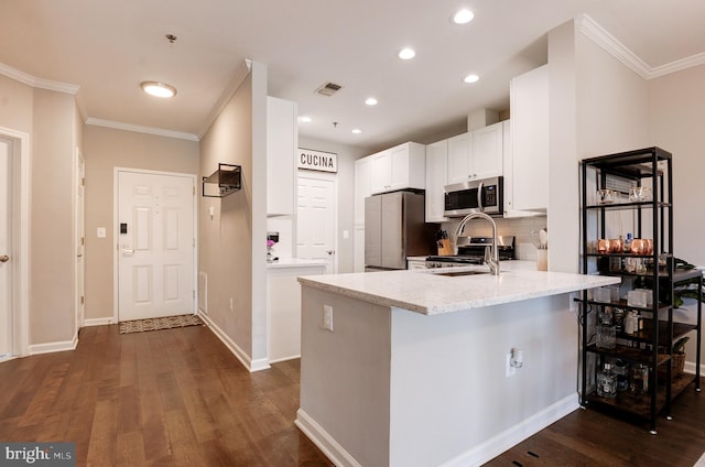 kitchen with dark hardwood / wood-style floors, kitchen peninsula, stainless steel appliances, light stone countertops, and white cabinets