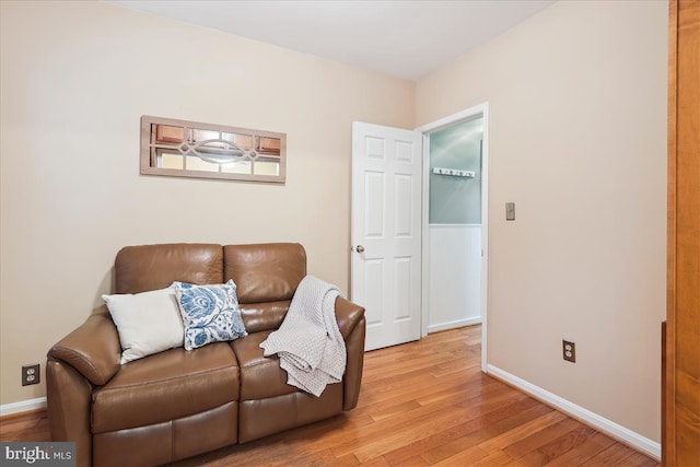 sitting room with hardwood / wood-style floors