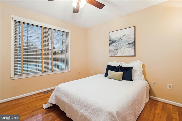 bedroom featuring ceiling fan and hardwood / wood-style floors