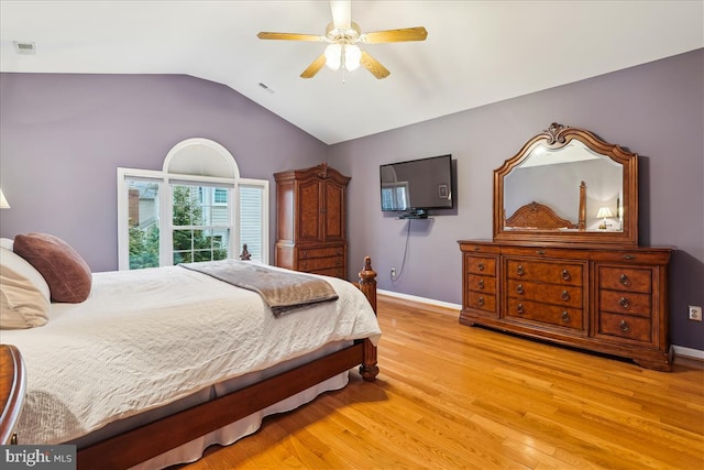 bedroom featuring vaulted ceiling, ceiling fan, and light hardwood / wood-style floors