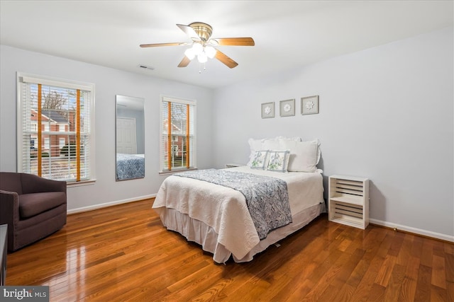 bedroom with hardwood / wood-style flooring and ceiling fan