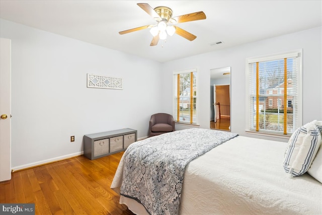 bedroom featuring ceiling fan and wood-type flooring