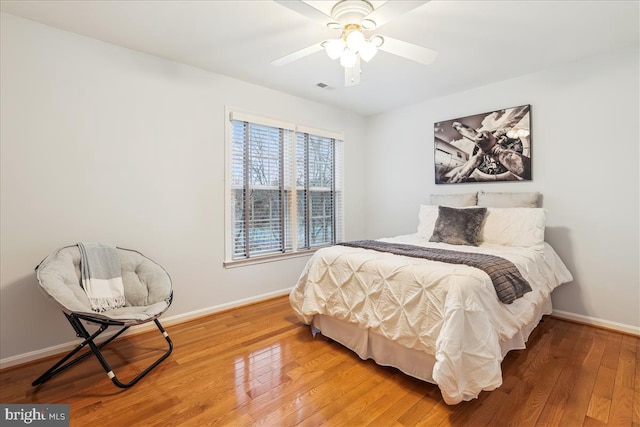 bedroom featuring hardwood / wood-style flooring and ceiling fan