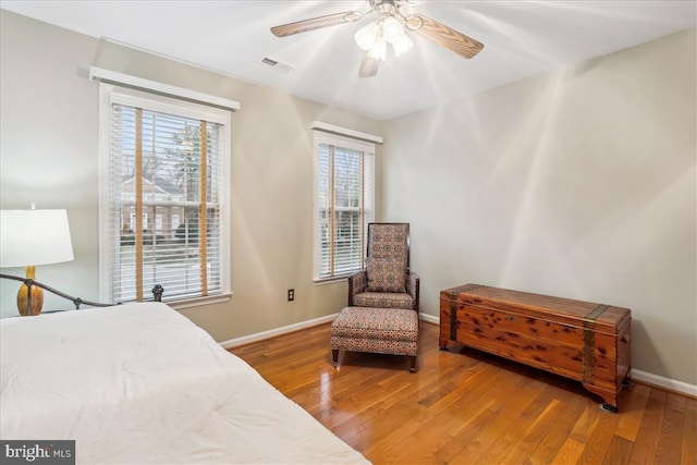 bedroom featuring ceiling fan and wood-type flooring