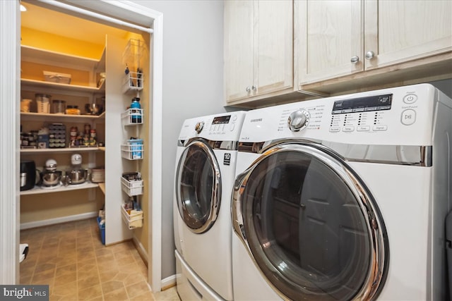 clothes washing area with cabinets, light tile patterned floors, and independent washer and dryer