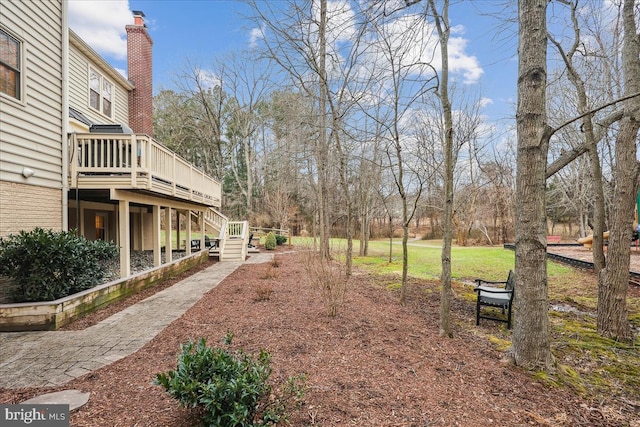 view of yard with a wooden deck