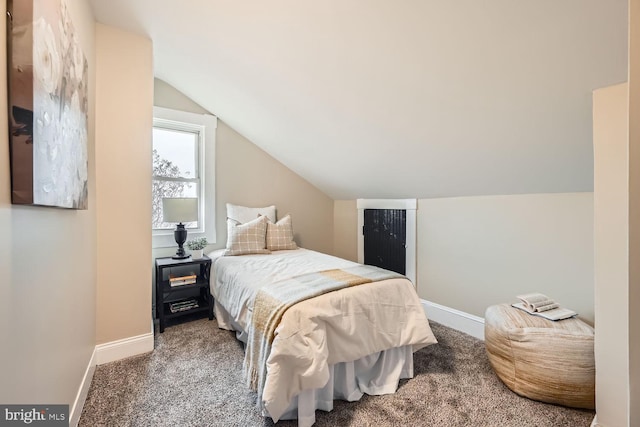 carpeted bedroom with vaulted ceiling