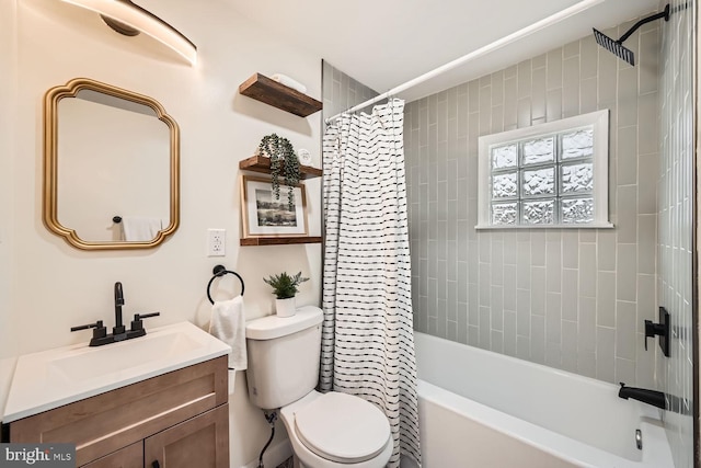 full bathroom featuring vanity, shower / tub combo with curtain, and toilet