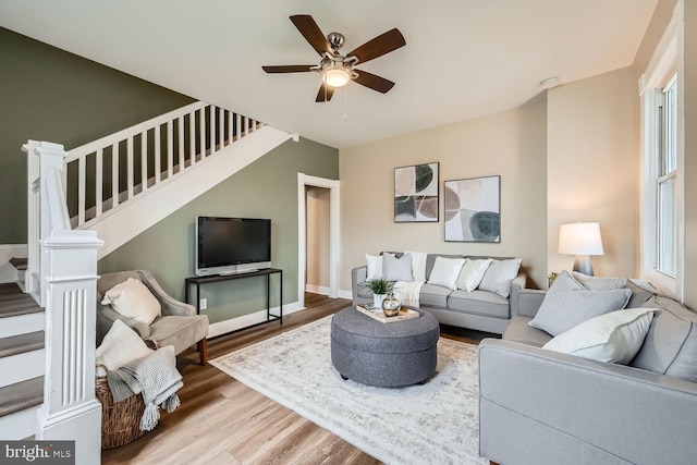 living room with hardwood / wood-style flooring and ceiling fan