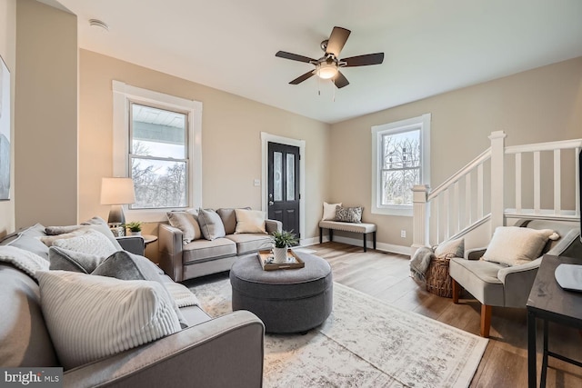 living room featuring ceiling fan and wood-type flooring