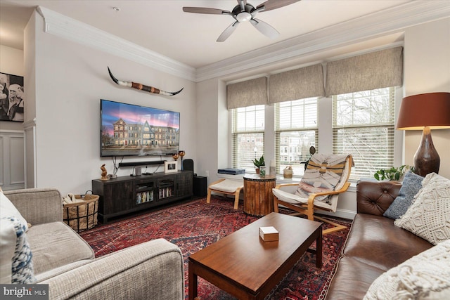 living room featuring ceiling fan, ornamental molding, and dark hardwood / wood-style flooring