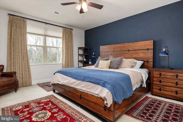 bedroom with ceiling fan and carpet