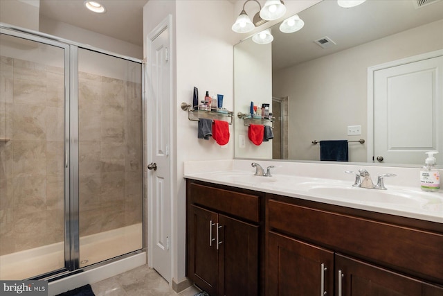 bathroom featuring vanity and a shower with shower door