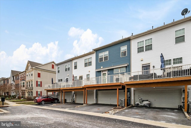 rear view of property featuring central AC unit