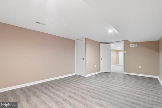 unfurnished room with light hardwood / wood-style floors