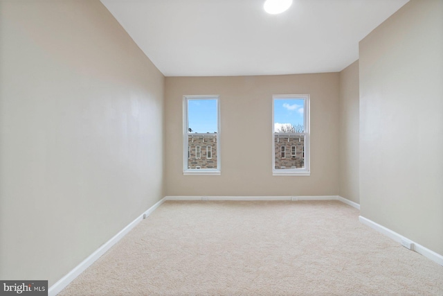 unfurnished room with carpet floors