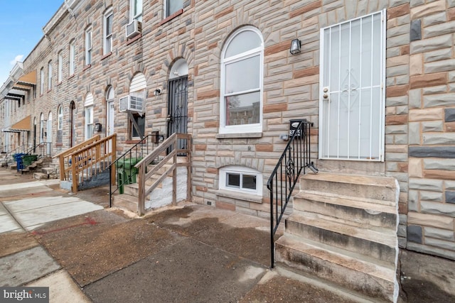 doorway to property with cooling unit