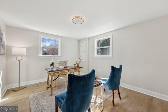 office space featuring light wood-style flooring and baseboards