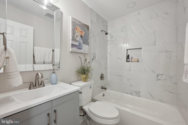 full bathroom featuring toilet, washtub / shower combination, visible vents, and vanity