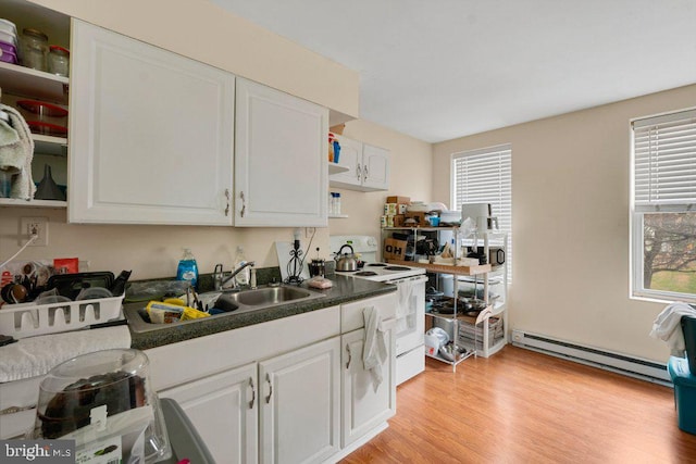 kitchen featuring white electric range, sink, light hardwood / wood-style flooring, a baseboard radiator, and white cabinets