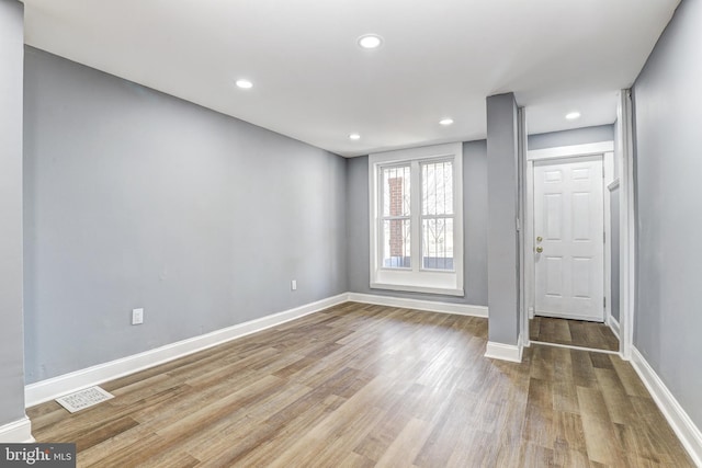 unfurnished room featuring light hardwood / wood-style flooring