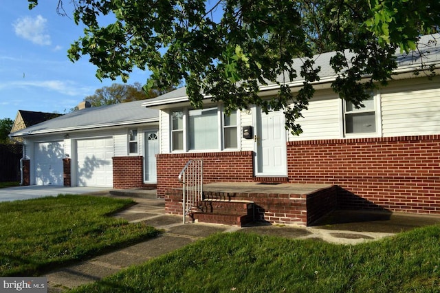 view of front of home with a garage, driveway, and brick siding