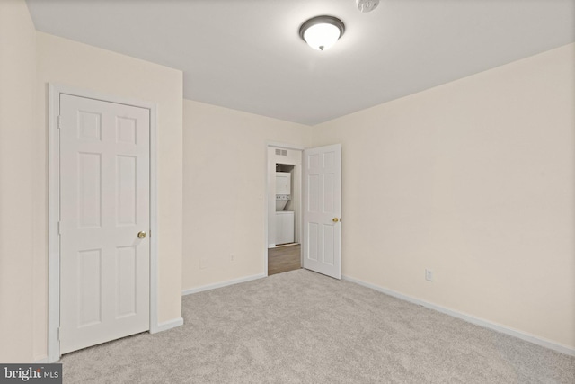 unfurnished bedroom with baseboards and carpet flooring