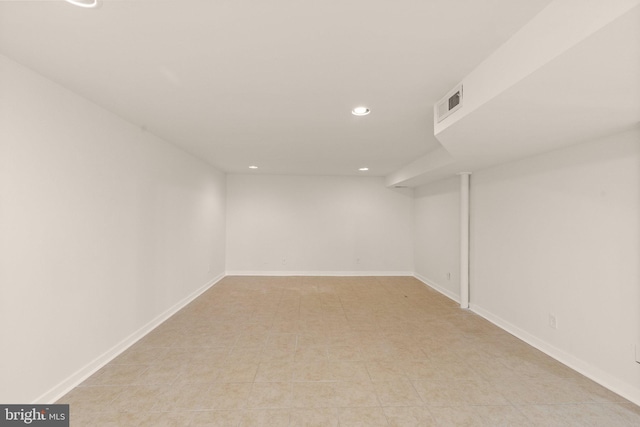 finished below grade area featuring recessed lighting, visible vents, and baseboards