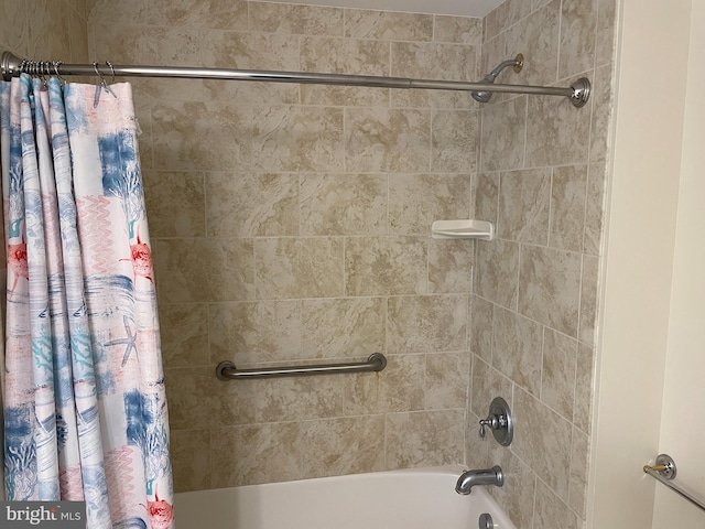 bathroom featuring shower / tub combo with curtain