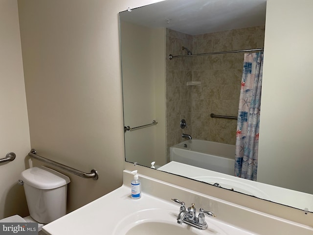 full bathroom with sink, toilet, and shower / bath combo with shower curtain