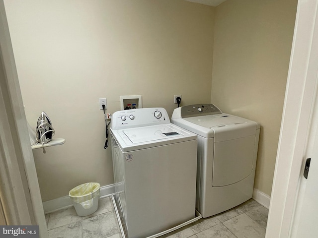 clothes washing area with washer and dryer