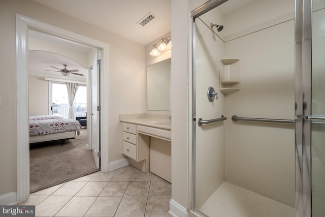 bathroom with vanity, ceiling fan, an enclosed shower, and tile patterned floors