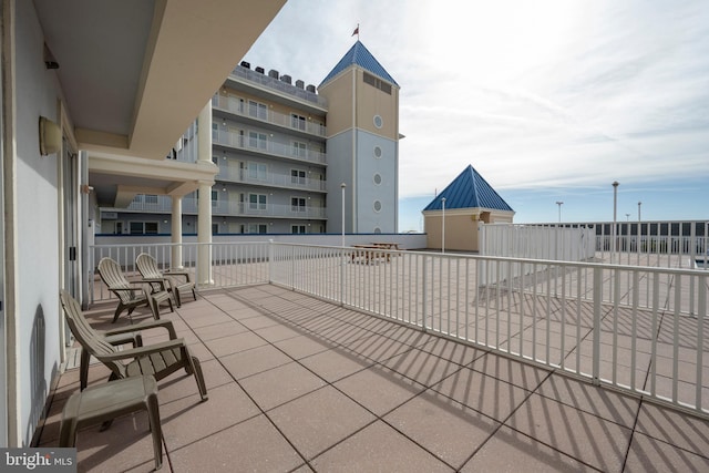 view of patio with a balcony