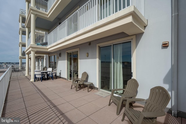 view of patio with a balcony