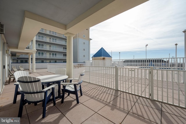 view of patio featuring a balcony