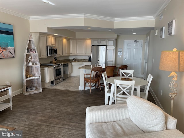 interior space with sink, ornamental molding, and light hardwood / wood-style floors