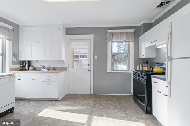 kitchen featuring crown molding, sink, white cabinets, and white appliances