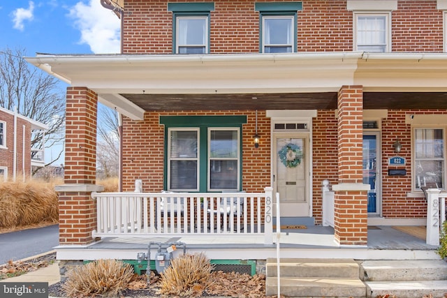 entrance to property with a porch