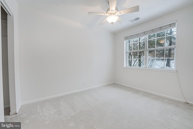 unfurnished bedroom with light carpet and ceiling fan