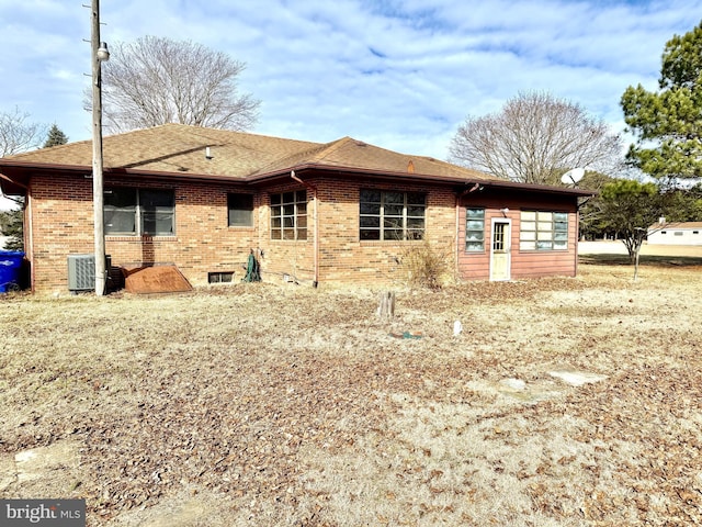 rear view of property featuring central AC