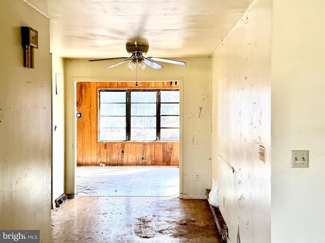 interior space featuring ceiling fan