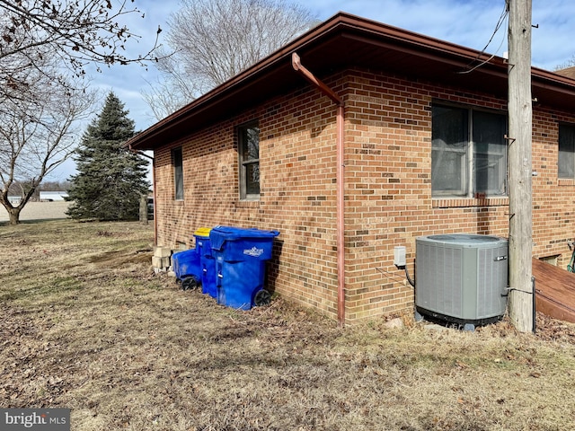 view of side of home featuring central air condition unit