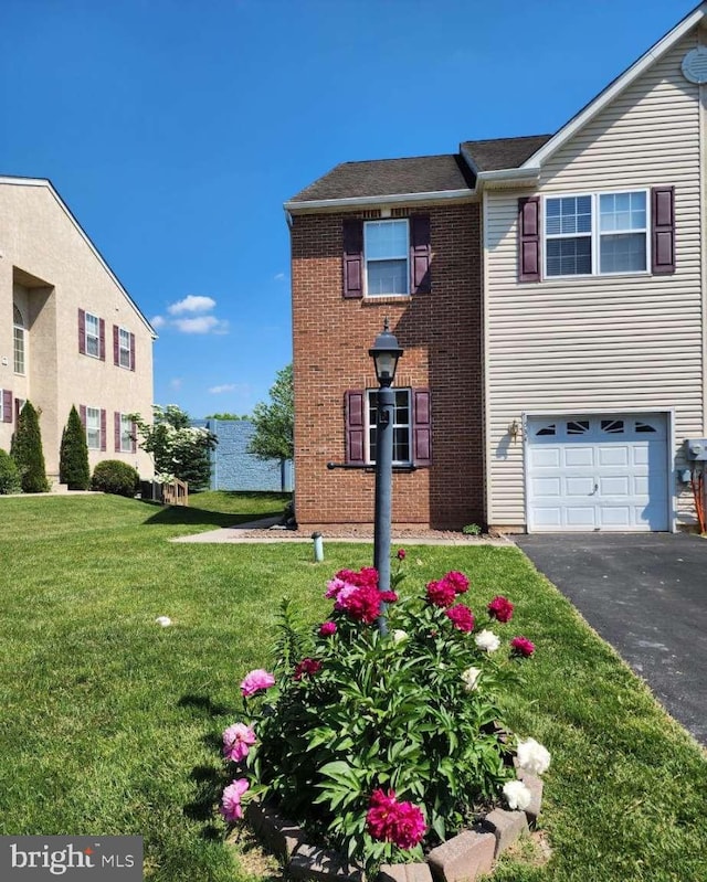 view of property exterior featuring a garage and a lawn