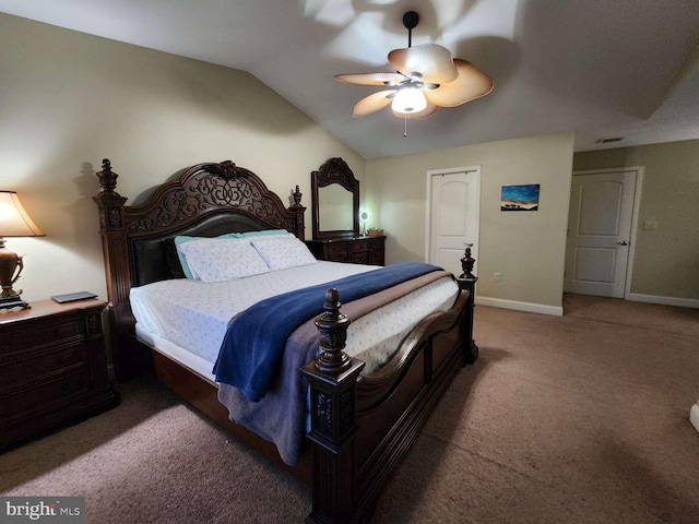 bedroom featuring vaulted ceiling, ceiling fan, and carpet flooring