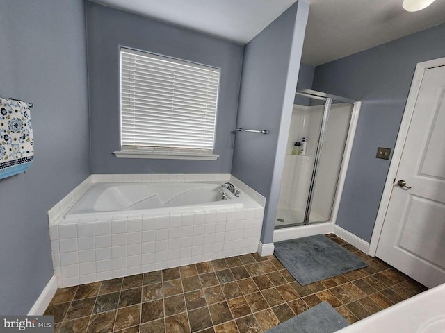 bathroom with separate shower and tub