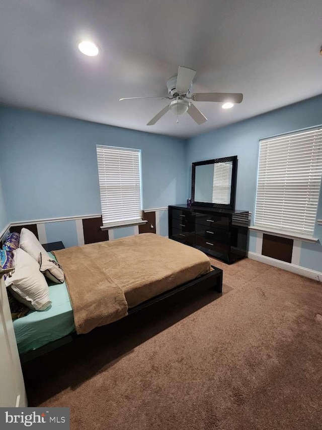 bedroom featuring ceiling fan and carpet floors