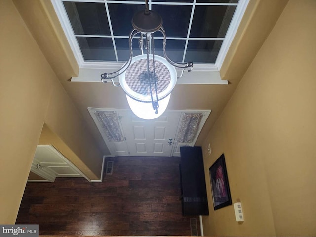 foyer with dark hardwood / wood-style flooring