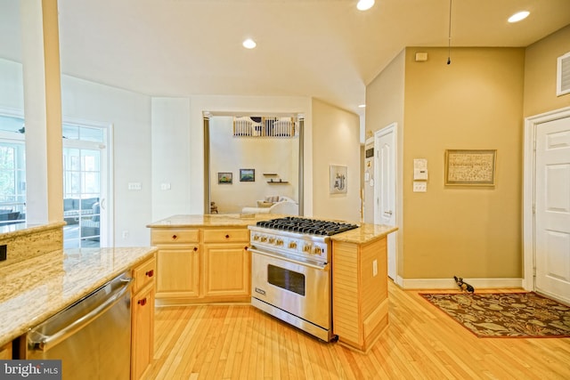 kitchen with light wood finished floors, recessed lighting, stainless steel appliances, and light brown cabinetry