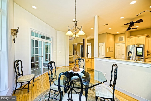 dining room featuring light wood-style floors, baseboards, visible vents, and recessed lighting